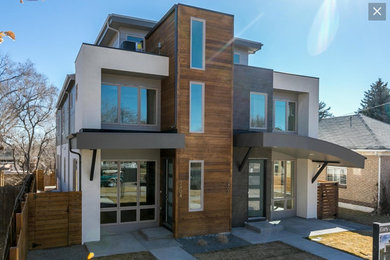 Inspiration for a mid-sized modern three-story townhouse exterior remodel in Denver