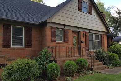 Inspiration for a mid-sized craftsman multicolored two-story mixed siding gable roof remodel in Charlotte