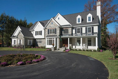 Inspiration for a large timeless white two-story mixed siding exterior home remodel in Philadelphia with a shingle roof