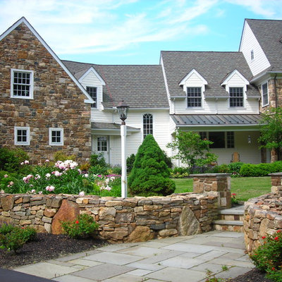 Large elegant three-story stone exterior home photo in Philadelphia