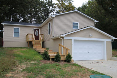 Mid-sized cottage beige one-story vinyl gable roof idea in DC Metro