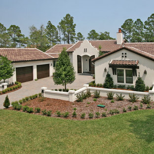 Inspiration for a mediterranean stucco exterior home remodel in Jacksonville