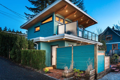 Rustic blue two-story wood exterior home idea in Vancouver