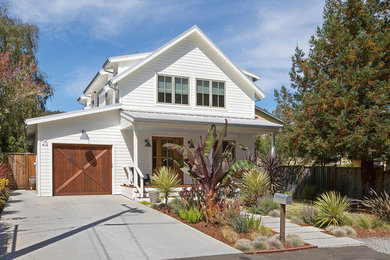 Large cottage white two-story wood exterior home idea in San Francisco