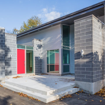 Custom Modern Gray Exterior with Red Entry Door