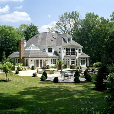 Elegant white two-story exterior home photo in Boston with a hip roof