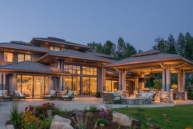 Example of a large trendy gray three-story mixed siding exterior home design in Seattle with a hip roof