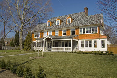 Inspiration for a large timeless brown three-story wood gable roof remodel in Philadelphia