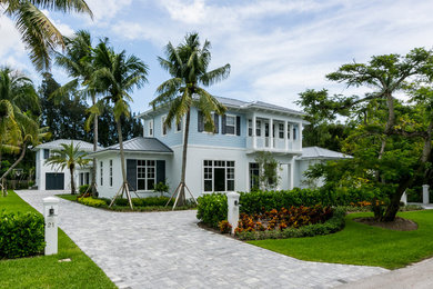 Example of a transitional blue two-story mixed siding exterior home design in Miami