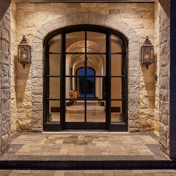 Custom Stone Entry with Glass and Metal Doors
