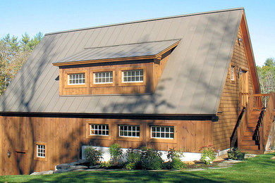 Example of a brown two-story wood exterior home design in Boston
