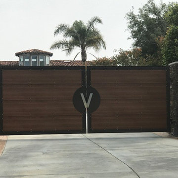 Custom wood and steel double swing automatic gate installed in Malibu, CA