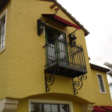 Custom wrought iron balony with rails and brackets; scroll style design