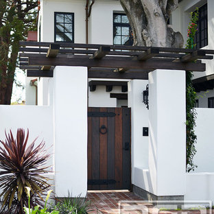 Customized Wood Garage Door & Gate Design in an Authentic Spanish Colonial Style