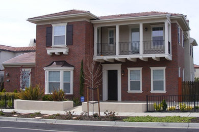 Example of a large trendy two-story brick house exterior design in San Francisco