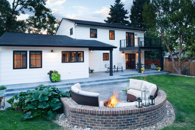 Farmhouse white two-story concrete fiberboard exterior home photo in Denver with a shingle roof