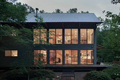 Inspiration for a contemporary green two-story concrete fiberboard exterior home remodel in Raleigh