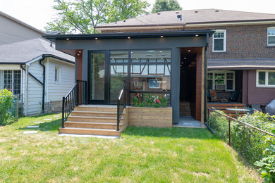Transitional exterior home idea in Toronto