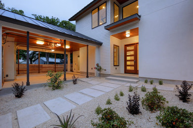 Inspiration for a large and white two floor detached house in Austin with mixed cladding.