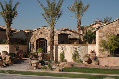 Example of a tuscan exterior home design in Phoenix