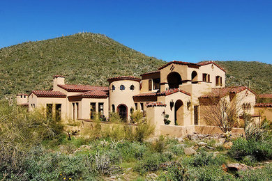 Example of a tuscan exterior home design in Phoenix