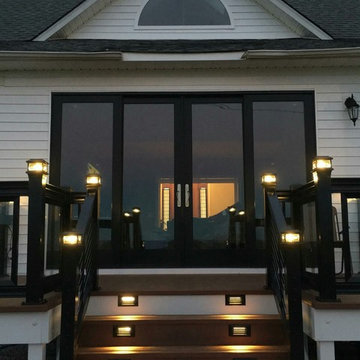 Decks with glass handrails and cable rails