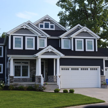Deep navy house white trim Custom home with front porch