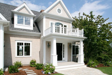 Mid-sized contemporary beige two-story wood gable roof idea in Boston