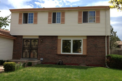 Mid-sized elegant beige two-story mixed siding gable roof photo in Denver