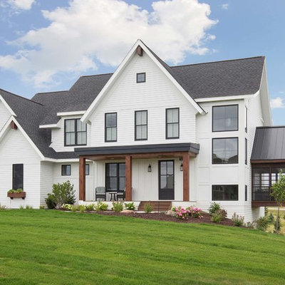 Country white two-story exterior home idea in Minneapolis with a shingle roof