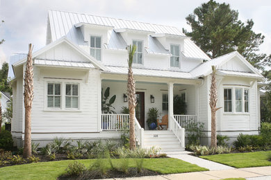 Island style white two-story exterior home photo in Charleston
