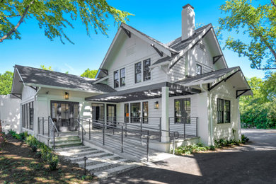 Inspiration for a mid-sized craftsman white two-story wood exterior home remodel in Charlotte with a shingle roof