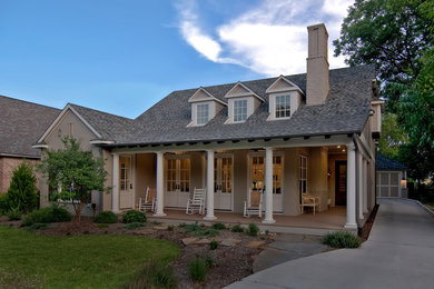 Example of a mid-sized classic beige two-story brick exterior home design in Dallas
