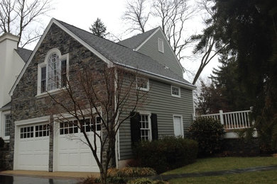Mid-sized traditional gray one-story mixed siding exterior home idea in New York with a mixed material roof