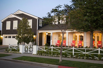 Inspiration for a large timeless two-story exterior home remodel in Orange County