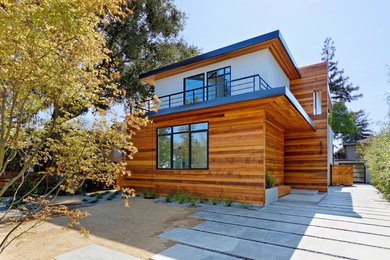 Example of a large minimalist brown two-story wood flat roof design in San Francisco