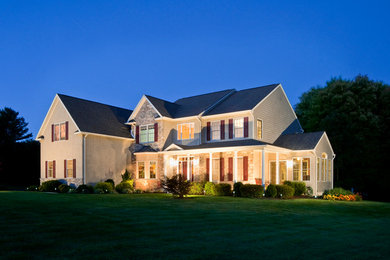 Inspiration for a large timeless two-story mixed siding exterior home remodel in Philadelphia