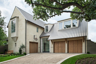 Example of a large classic multicolored two-story mixed siding house exterior design in Houston with a metal roof