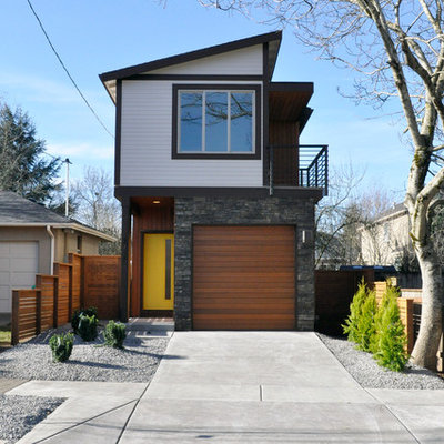 Contemporary two-story exterior home idea in Portland with a shed roof
