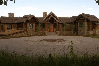 Example of a large classic brown two-story wood gable roof design in Boise