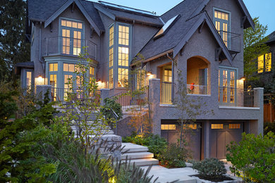 Mid-sized gray three-story stucco exterior home idea in Vancouver