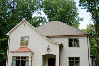 Photo of a large and white classic two floor brick house exterior in Birmingham.