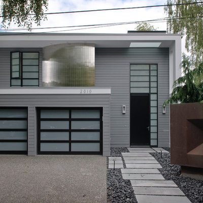 Example of a trendy gray two-story wood exterior home design in Seattle