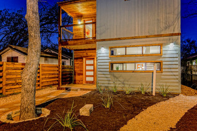 Inspiration for a small modern green two-story wood exterior home remodel in Austin
