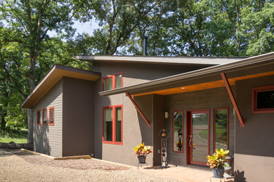 Mid-sized trendy gray one-story mixed siding exterior home photo in Other with a shingle roof