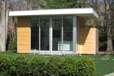 Einstöckige Moderne Holzfassade Haus mit grauer Fassadenfarbe in New York