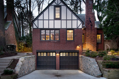 Inspiration for a mid-sized timeless red three-story brick gable roof remodel in Boston