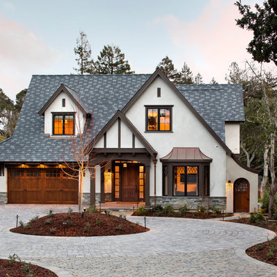 Mid-sized elegant white two-story stucco house exterior photo in San Francisco with a hip roof and a shingle roof