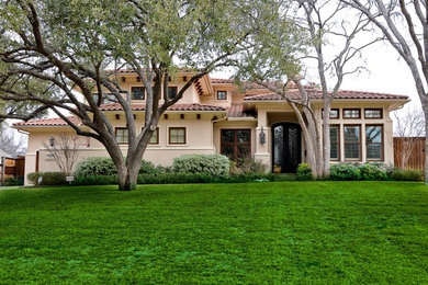 Example of a tuscan exterior home design in Dallas