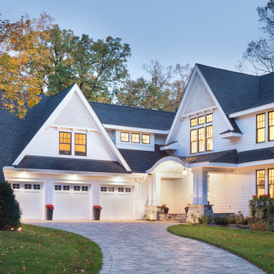 Example of a huge transitional white three-story concrete fiberboard exterior home design in Minneapolis with a shingle roof